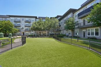 Courtyard with artificial turf and surrounding buildings